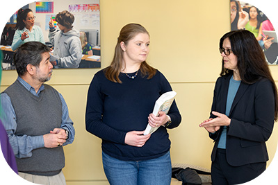 Three people in conversation
